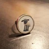 Round shaped metallic ring, a personalised order with 'Shaun the Sheep' printed on metal.