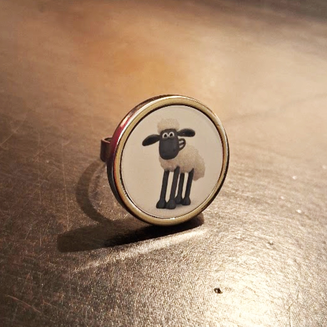 Round shaped metallic ring, a personalised order with 'Shaun the Sheep' printed on metal.
