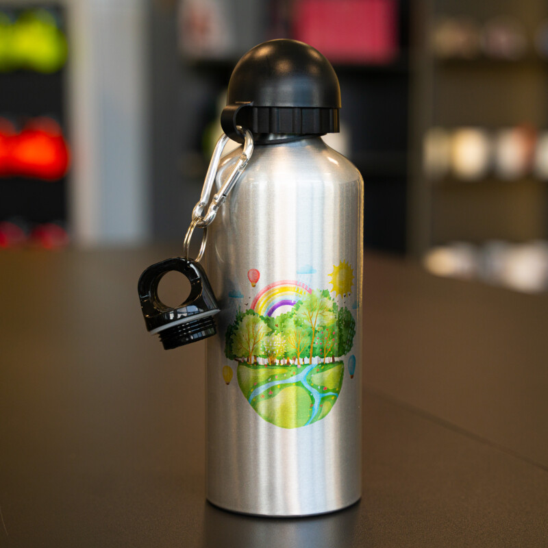 Personalised bottle silver aluminium 600ml with a design of a forest, river and sunshine, with 2 lids