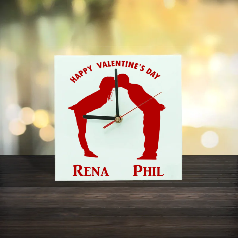 glass-square-clock-30cm. Personalised Glass Square wall clock 20cm, silhouette of a couple kissing and text Happy Valentine's Day Rena Phil
