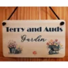 Personalised Wood Hanging Sign with black cord Personalised Wood Hanging Sign with black cord personalised: Terry and Auds Garden with flowers on the design