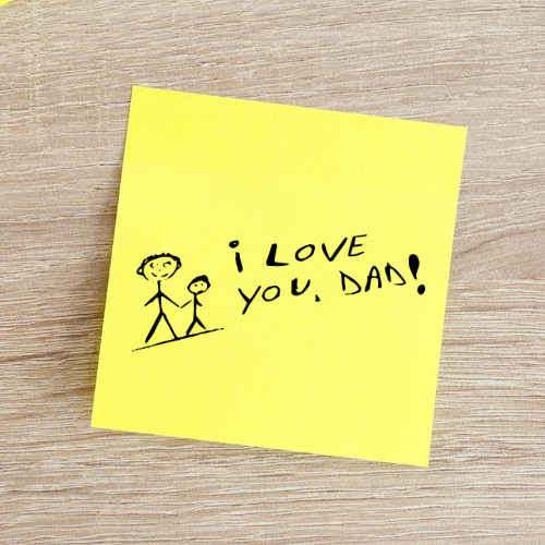 A note featuring a child’s handwritten message, I love you DAD!