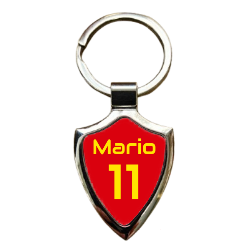 Personalised Shield Metal Keyring with a red design and yellow letters writing Mario 11