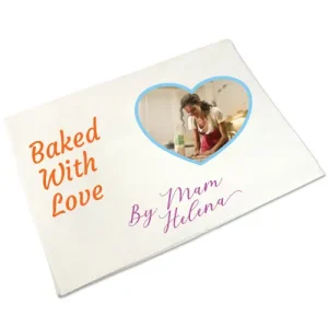 Personalised Cotton Tea Towel 'Baked with love by mam Helena' and a photo of a woman inside a heart shape frame with light blue border